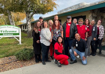 Staff and caregivers in the front walk of Willows Post Acute