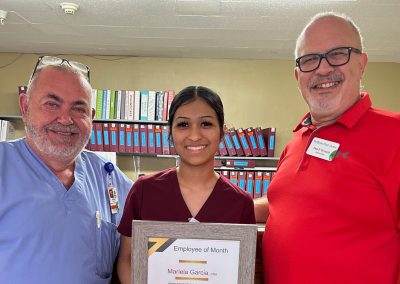 two staff members with nurse Mariela who received an Employee of the Month award The Willows Post Acute